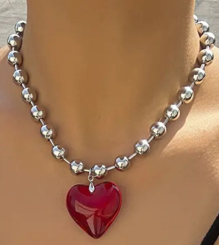 silver chain with red heart pendant